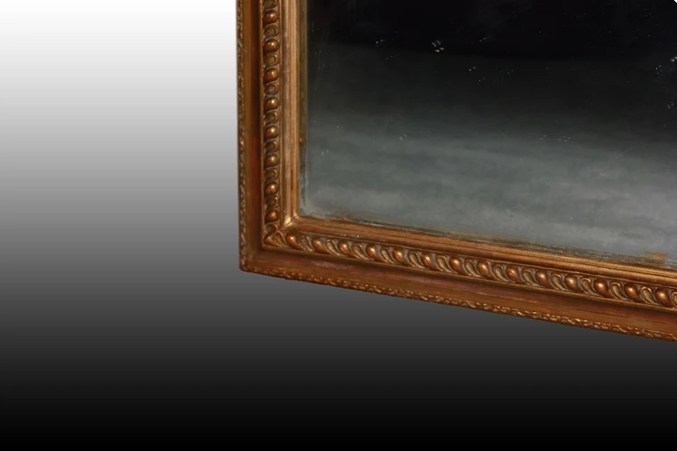 Grand miroir symétrique rectangulaire doré de style Louis XVI du 20ème siècle