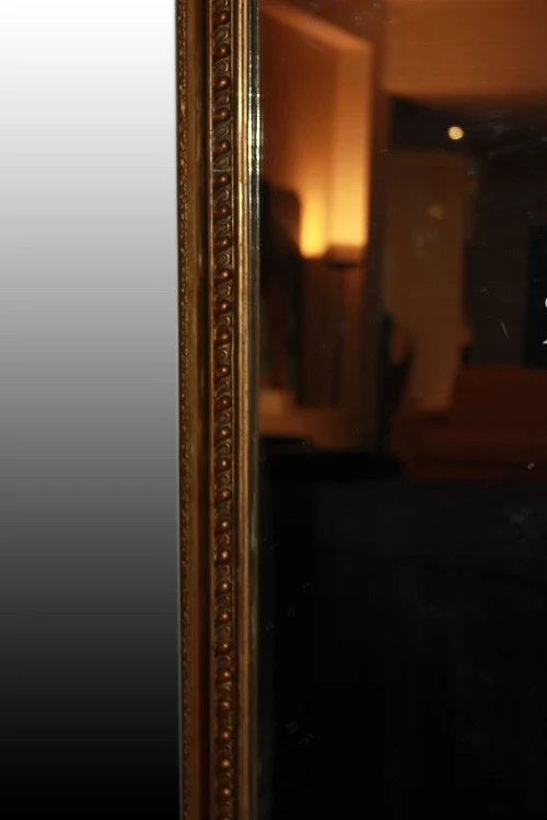 Grand miroir symétrique rectangulaire doré de style Louis XVI du 20ème siècle